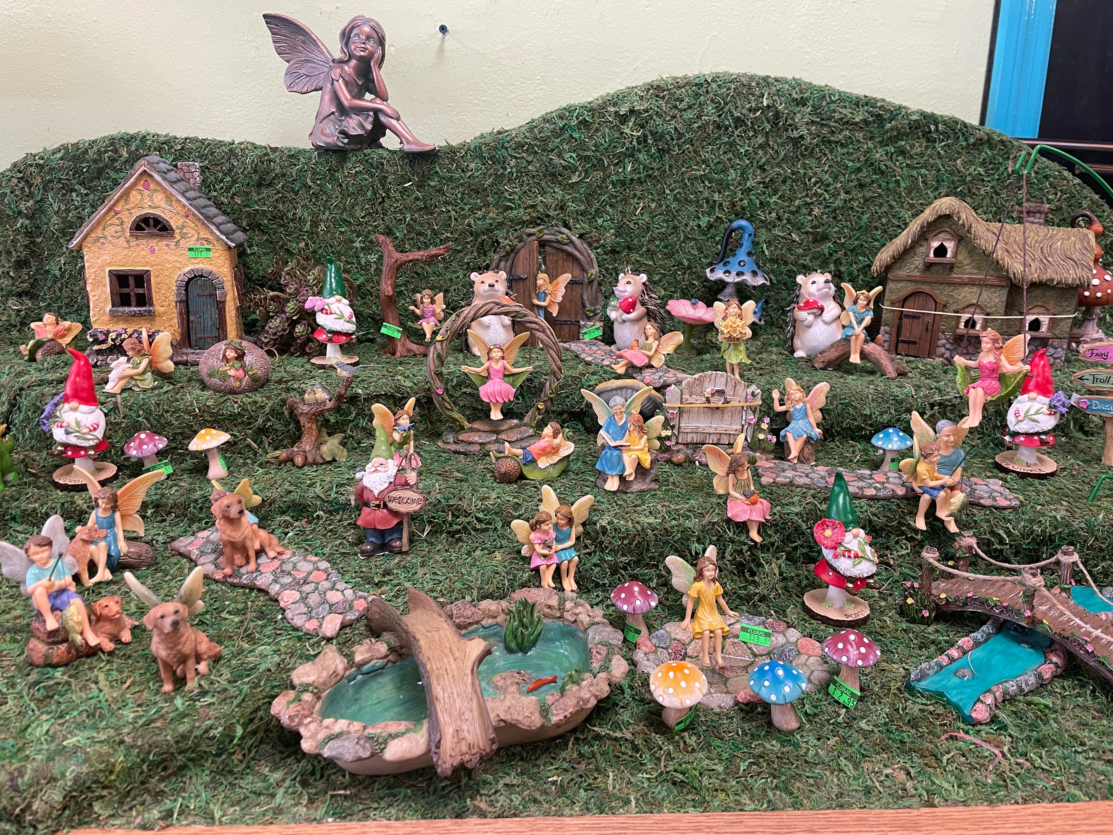 Discover a magical scene in our miniature fairy garden, brought to life with enchanting resin figurines. Each carefully placed piece adds a touch of whimsy and sophistication, creating a unique and colorful oasis for your gardening and landscaping pursuits.