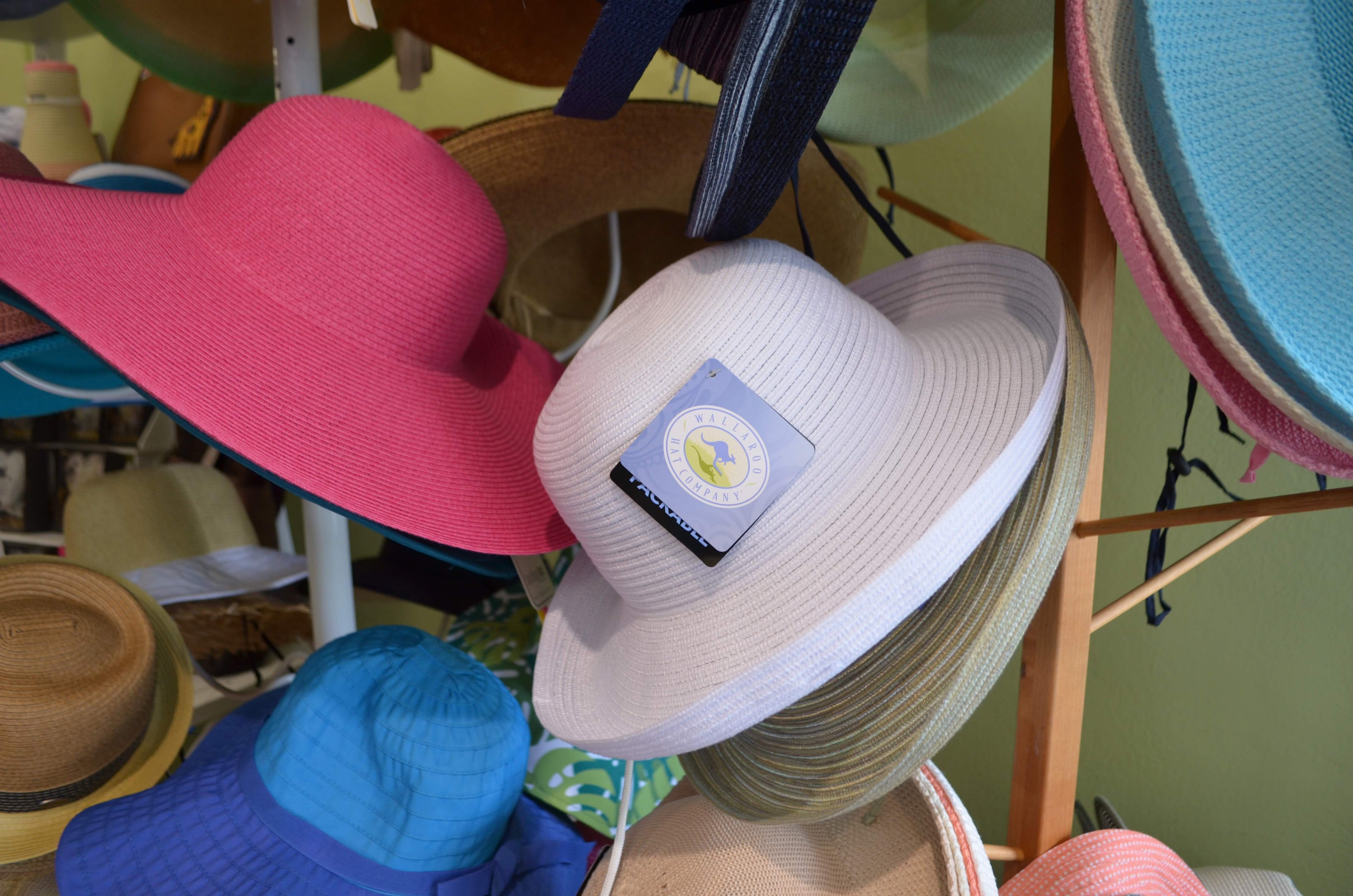 Explore a vibrant collection of sun-protective UPF 50+ hats on display in our Florida store. From classic to fashion-forward styles, these crushable and stylish hats offer effective UV protection for the savvy shopper seeking functional and colorful headwear options.