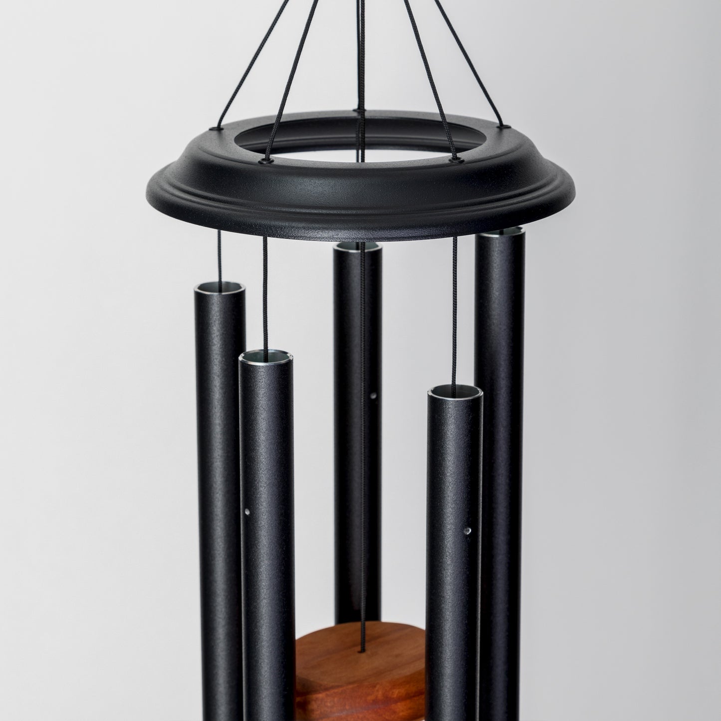 These Black Wind River Shenandoah Melodies wind chimes from Home and Garden Treasures are crafted with six hollow tubes of varying sizes suspended from a central ring, creating enchanting melodies as they dance in the breeze. Complete with a stylish round metal sail that catches gentle winds, each Shenandoah Melodies exemplifies the calming song of the Virginia countryside. Elevate your garden retreat with the perfect gift today!