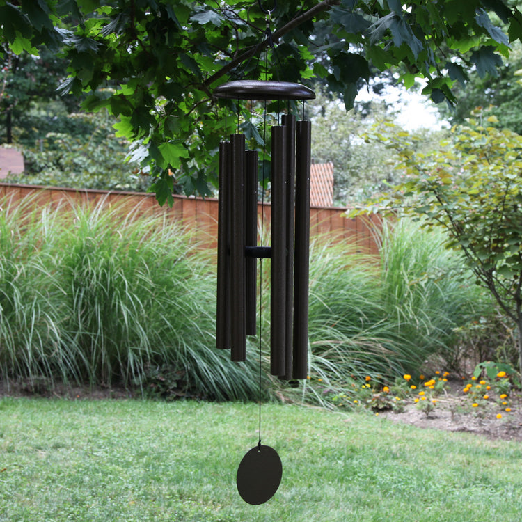  These Wind River Corinthian Bells wind chimes from Home and Garden Treasures are crafted with six hollow tubes of varying sizes suspended from a central ring, creating enchanting melodies as they dance in the breeze.