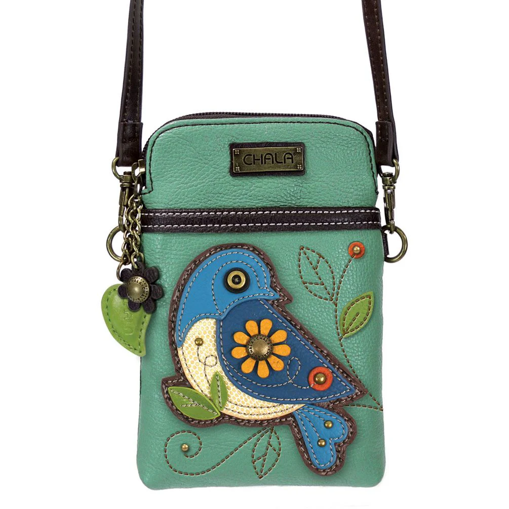 Elevate your style with the delightful Chala vegan leather crossbody handbag, featuring a whimsical Blue Bird Chala Pal companion on the front. Crafted with cruelty-free materials, this charming accessory blends fashion with personality, making a statement that is both playful and environmentally conscious. Experience the perfect blend of whimsy and elegance with every wear, showcasing your unique flair wherever you go.