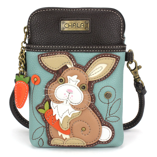 Elevate your style with the delightful Chala vegan leather crossbody handbag, featuring a whimsical Bunny Rabbit Chala Pal companion on the front. Crafted with cruelty-free materials, this charming accessory blends fashion with personality, making a statement that is both playful and environmentally conscious. Experience the perfect blend of whimsy and elegance with every wear, showcasing your unique flair wherever you go.