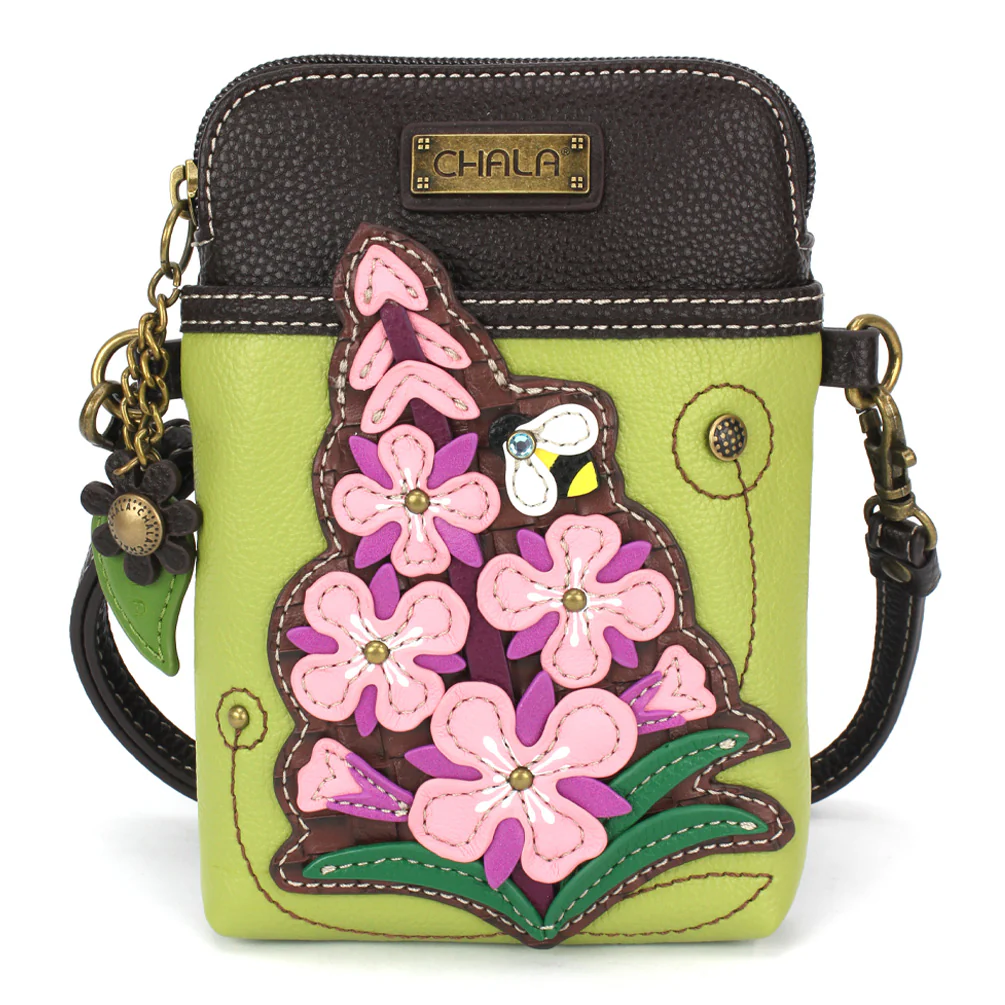 Elevate your style with the delightful Chala vegan leather crossbody handbag, featuring a whimsical Fireweed Chala Pal companion on the front. Crafted with cruelty-free materials, this charming accessory blends fashion with personality, making a statement that is both playful and environmentally conscious. Experience the perfect blend of whimsy and elegance with every wear, showcasing your unique flair wherever you go.