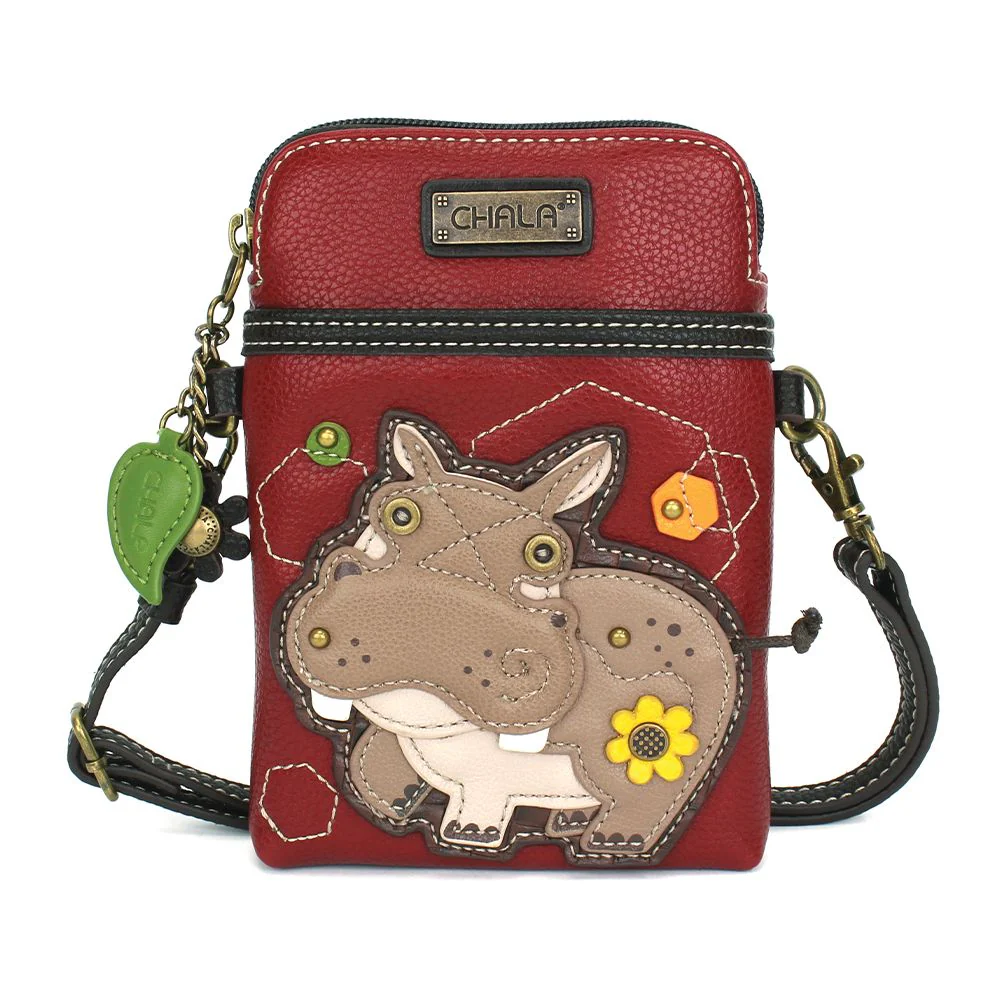Elevate your style with the delightful Chala vegan leather crossbody handbag, featuring a whimsical Hippo Chala Pal companion on the front. Crafted with cruelty-free materials, this charming accessory blends fashion with personality, making a statement that is both playful and environmentally conscious. Experience the perfect blend of whimsy and elegance with every wear, showcasing your unique flair wherever you go.