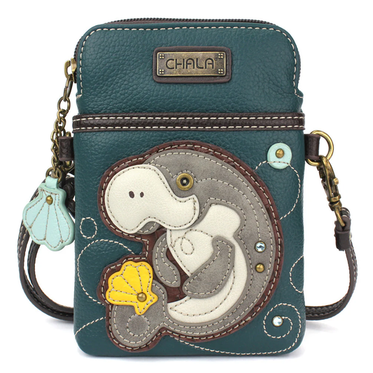 Elevate your style with the delightful Chala vegan leather crossbody handbag, featuring a whimsical Manatee Chala Pal companion on the front. Crafted with cruelty-free materials, this charming accessory blends fashion with personality, making a statement that is both playful and environmentally conscious. Experience the perfect blend of whimsy and elegance with every wear, showcasing your unique flair wherever you go.