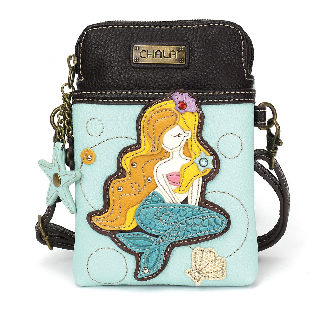 Elevate your style with the delightful Chala vegan leather crossbody handbag, featuring a whimsical Mermaid Chala Pal companion on the front. Crafted with cruelty-free materials, this charming accessory blends fashion with personality, making a statement that is both playful and environmentally conscious. Experience the perfect blend of whimsy and elegance with every wear, showcasing your unique flair wherever you go.