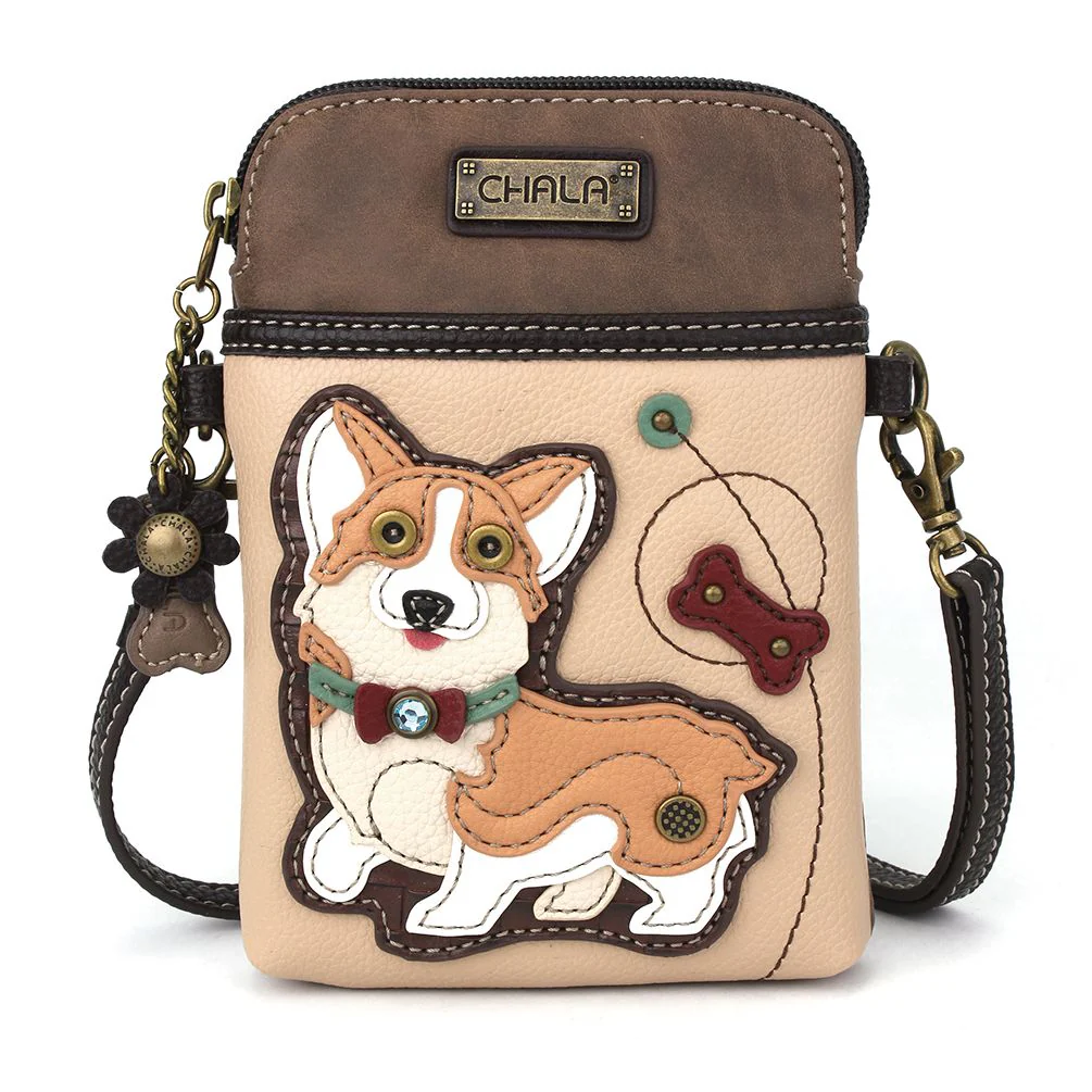 Elevate your style with the delightful Chala vegan leather crossbody handbag, featuring a whimsical Corgi Chala Pal companion on the front. Crafted with cruelty-free materials, this charming accessory blends fashion with personality, making a statement that is both playful and environmentally conscious. Experience the perfect blend of whimsy and elegance with every wear, showcasing your unique flair wherever you go.