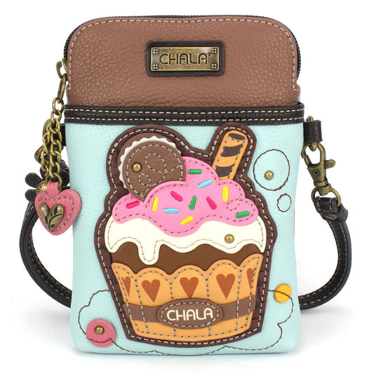 Elevate your style with the delightful Chala vegan leather crossbody handbag, featuring a whimsical Chala Pal Cupcake companion on the front. Crafted with cruelty-free materials, this charming accessory blends fashion with personality, making a statement that is both playful and environmentally conscious. Experience the perfect blend of whimsy and elegance with every wear, showcasing your unique flair wherever you go.