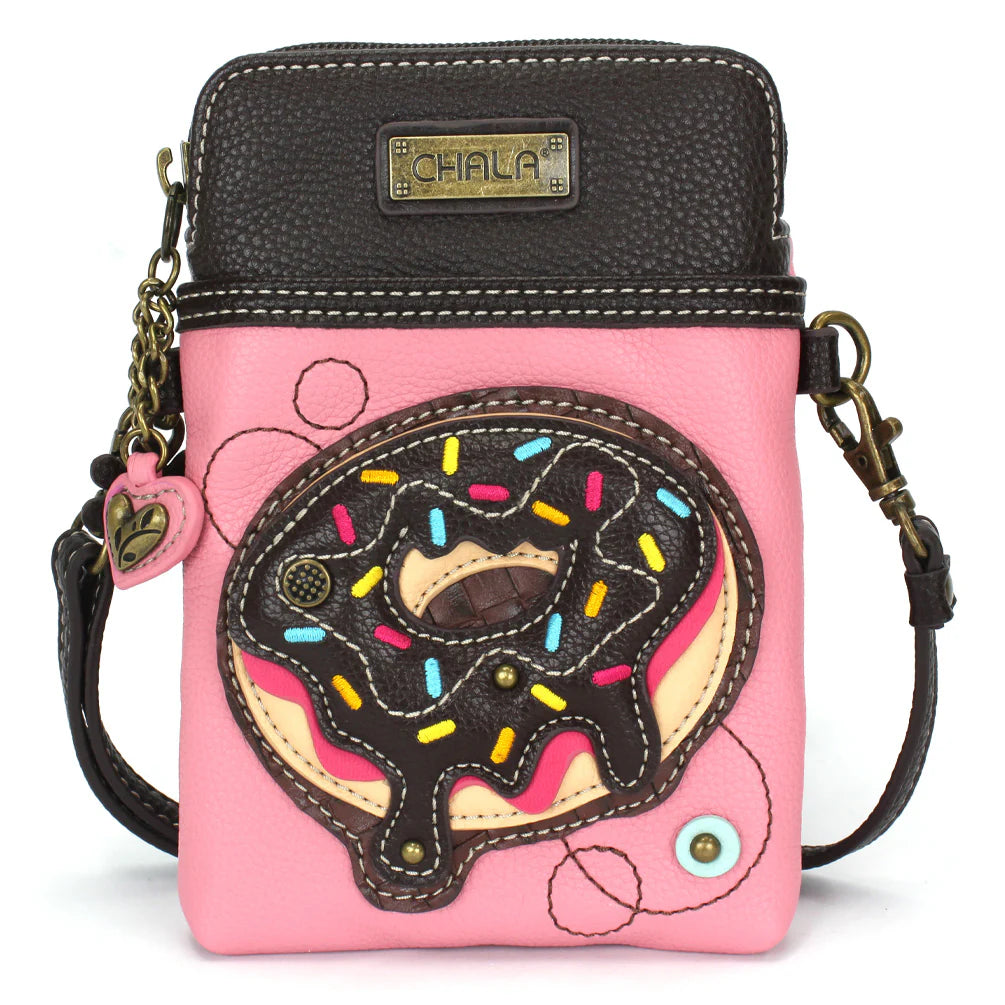 Elevate your style with the delightful Chala vegan leather crossbody handbag, featuring a whimsical Chala Pal Doughnut companion on the front. Crafted with cruelty-free materials, this charming accessory blends fashion with personality, making a statement that is both playful and environmentally conscious. Experience the perfect blend of whimsy and elegance with every wear, showcasing your unique flair wherever you go.