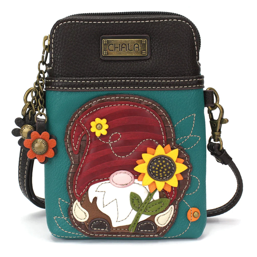 Elevate your style with the delightful Chala vegan leather crossbody handbag, featuring a whimsical Gnome Chala Pal companion on the front. Crafted with cruelty-free materials, this charming accessory blends fashion with personality, making a statement that is both playful and environmentally conscious. Experience the perfect blend of whimsy and elegance with every wear, showcasing your unique flair wherever you go.