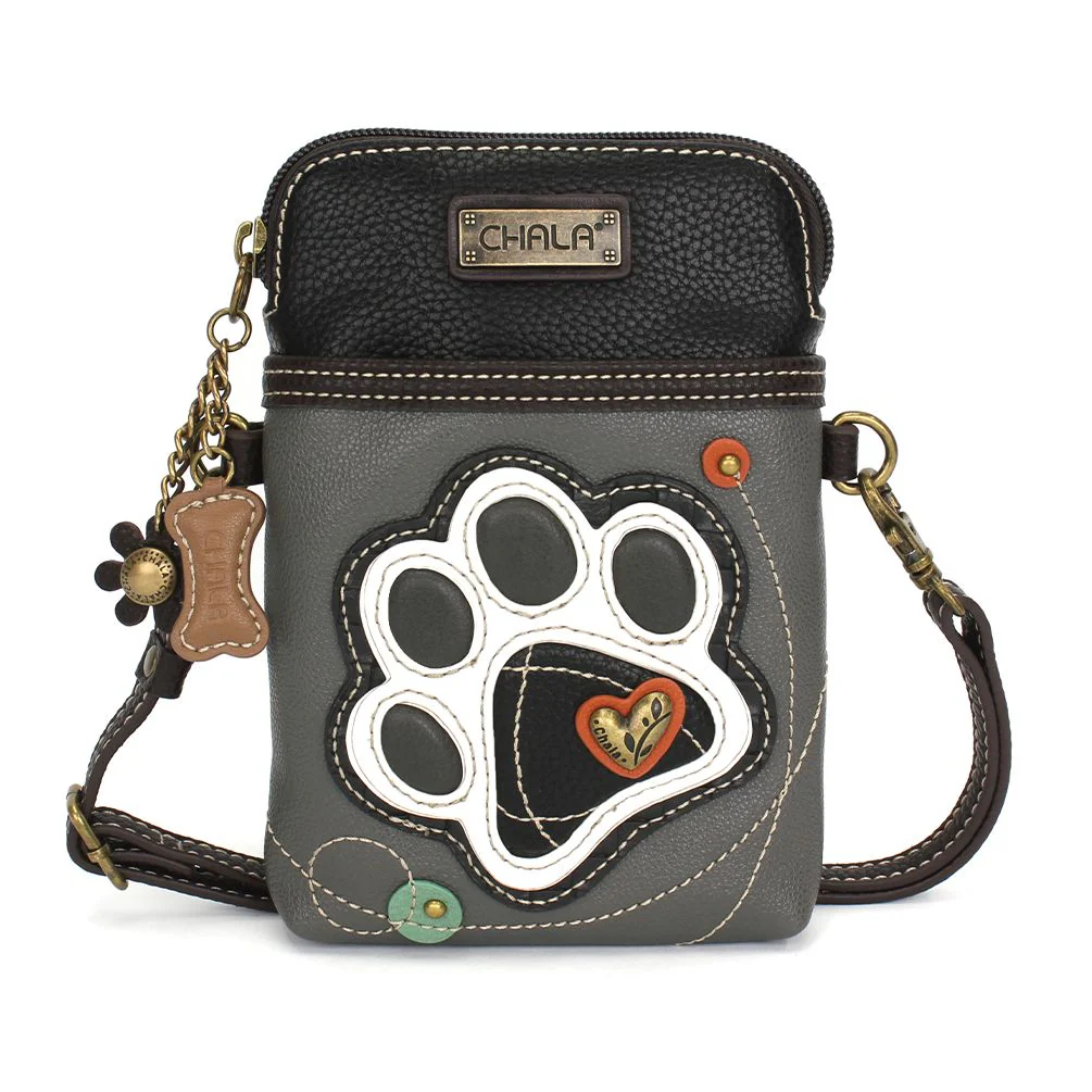 Elevate your style with the delightful Chala vegan leather crossbody handbag, featuring a whimsical Chala Pal Dog Paw companion on the front. Crafted with cruelty-free materials, this charming accessory blends fashion with personality, making a statement that is both playful and environmentally conscious. Experience the perfect blend of whimsy and elegance with every wear, showcasing your unique flair wherever you go.